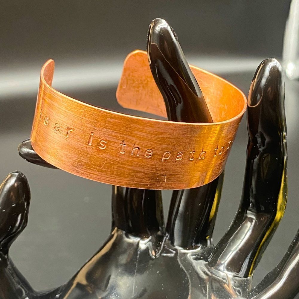 Ladies 5 3/4” copper bracelet imprinted with “fear is the path to the dark side”